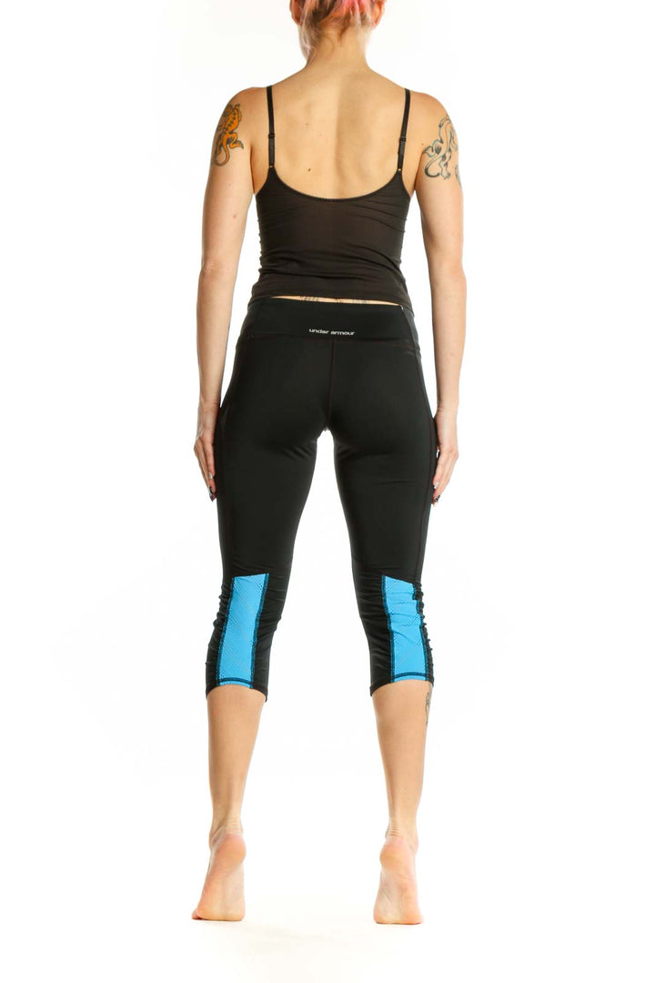 Black capri activewear leggings back view, showing supportive waistband and capri length