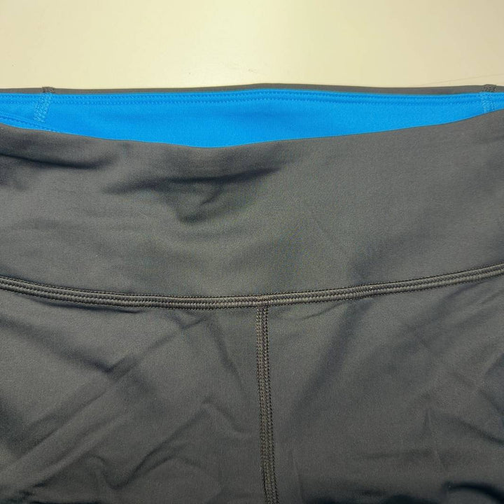 Black capri activewear leggings back view, showing supportive waistband and capri length