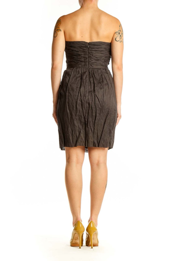 Black strapless J.Crew dress with ruched sweetheart neckline and gathered skirt, back view