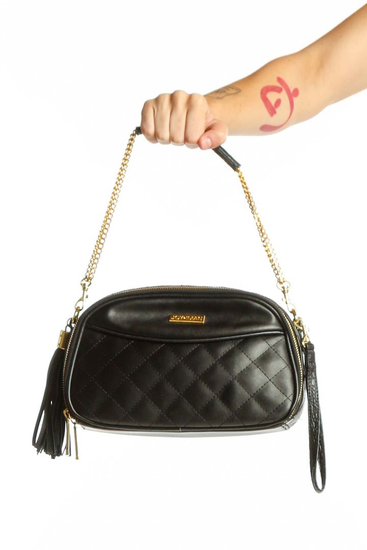 Black quilted leather shoulder bag with gold chain strap and tassel detail by Joy & Iman