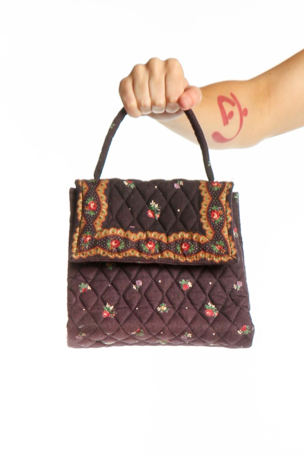 Brown quilted Vera Bradley satchel with floral embroidery and decorative trim, shown from front with dual handles