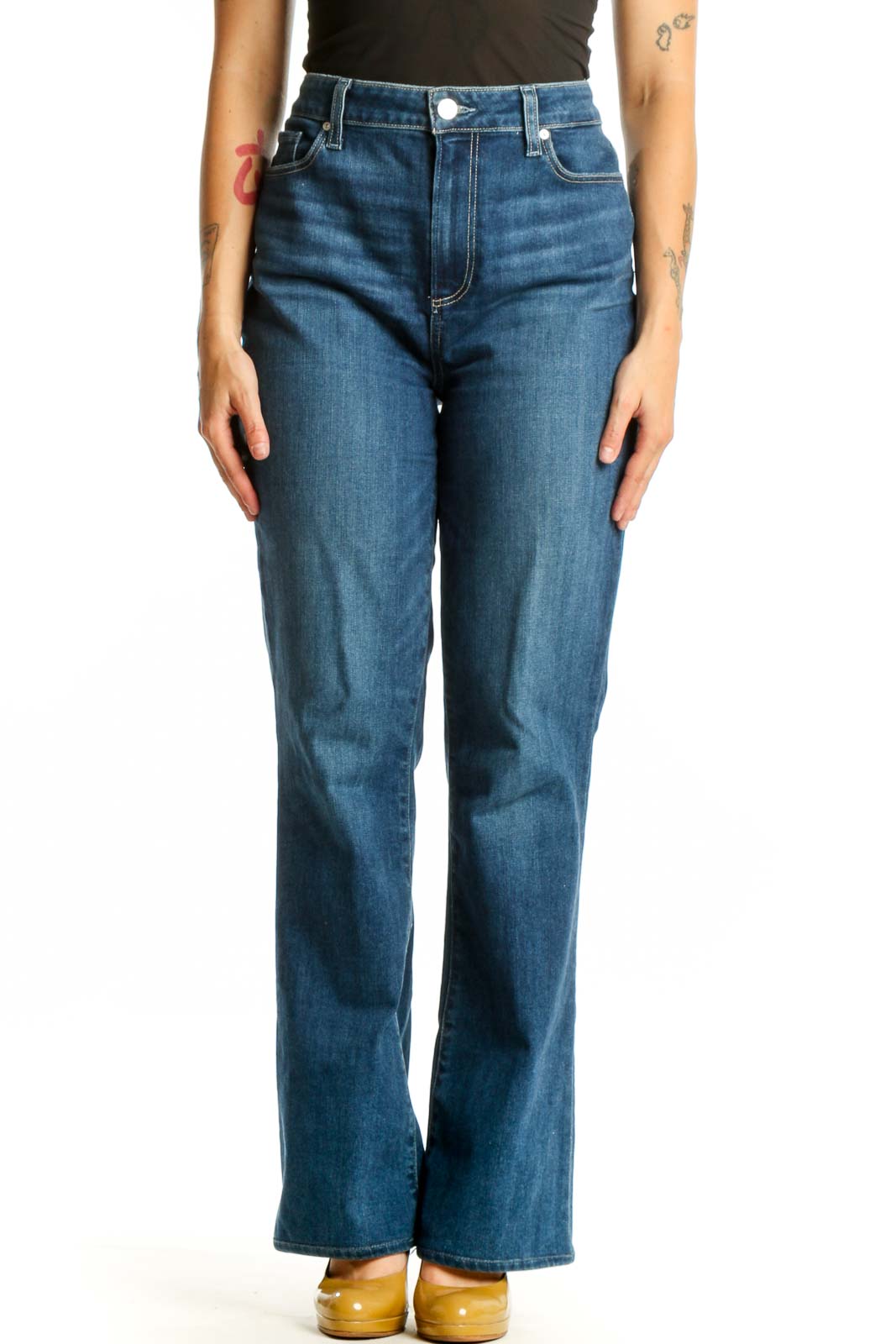 Woman wearing blue high-waisted flare denim jeans by Paige, front view