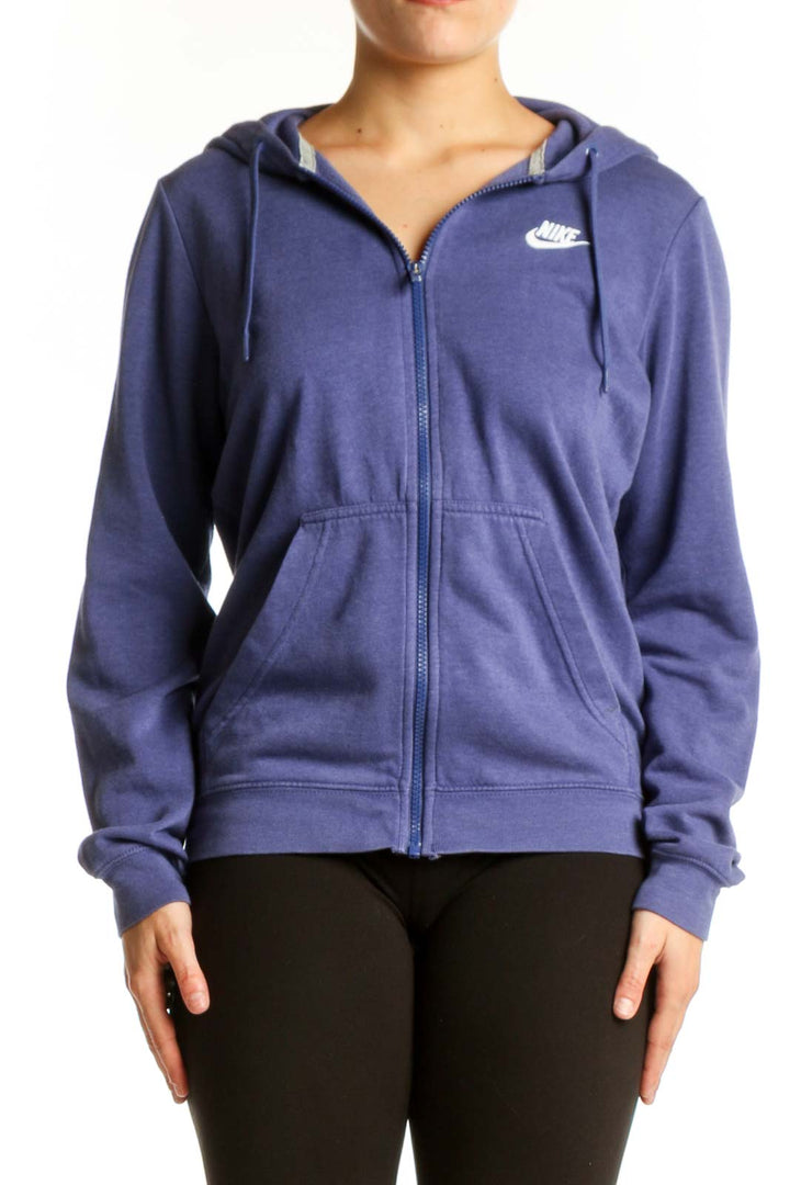 Navy Nike zip-up hoodie with Swoosh logo, front view on model
