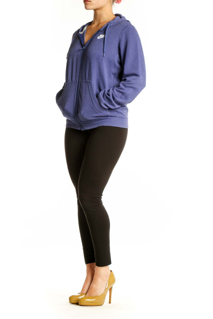 Navy Nike zip-up hoodie with Swoosh logo, front view on model