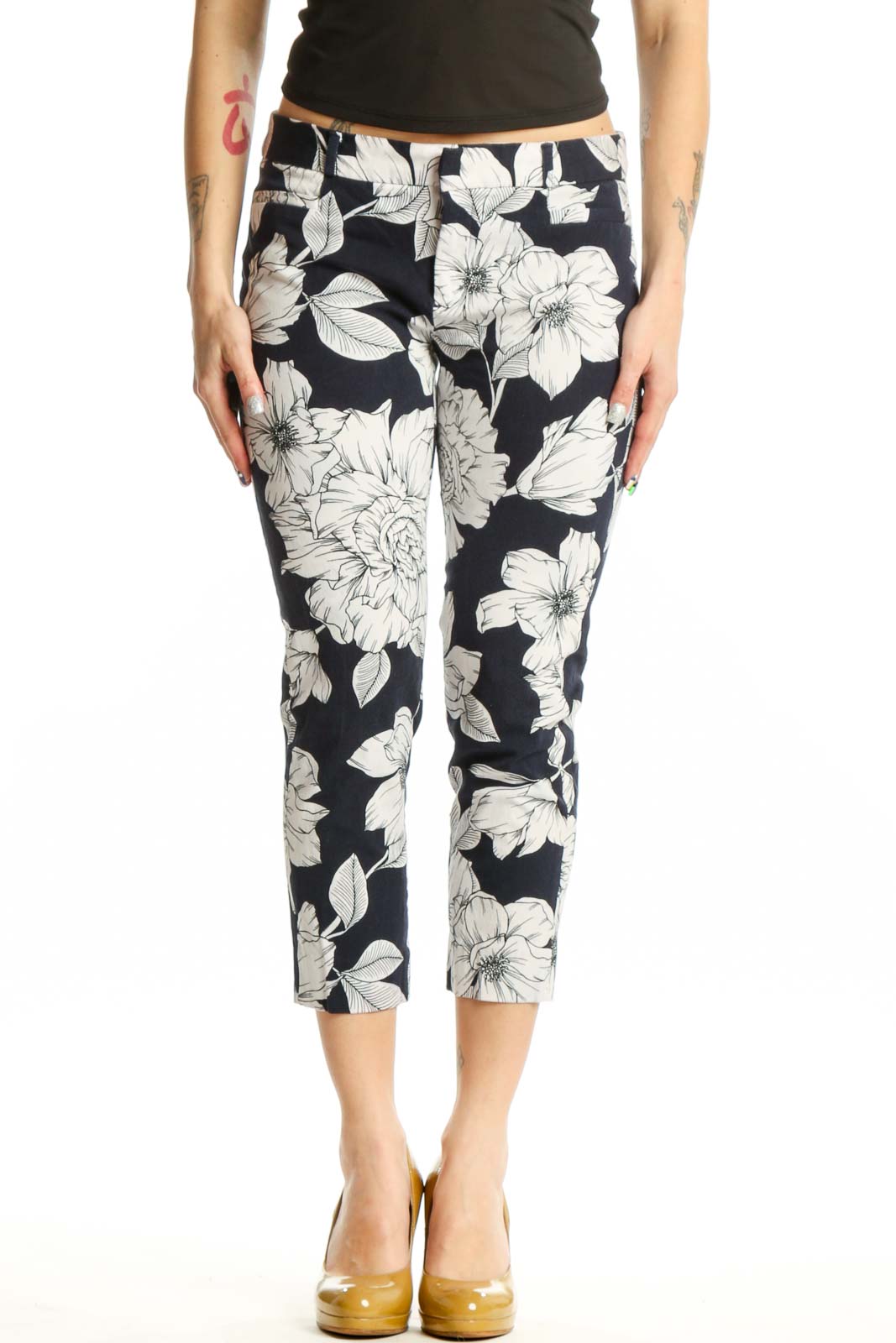 Navy floral cropped capri pants with white botanical print, front view on model