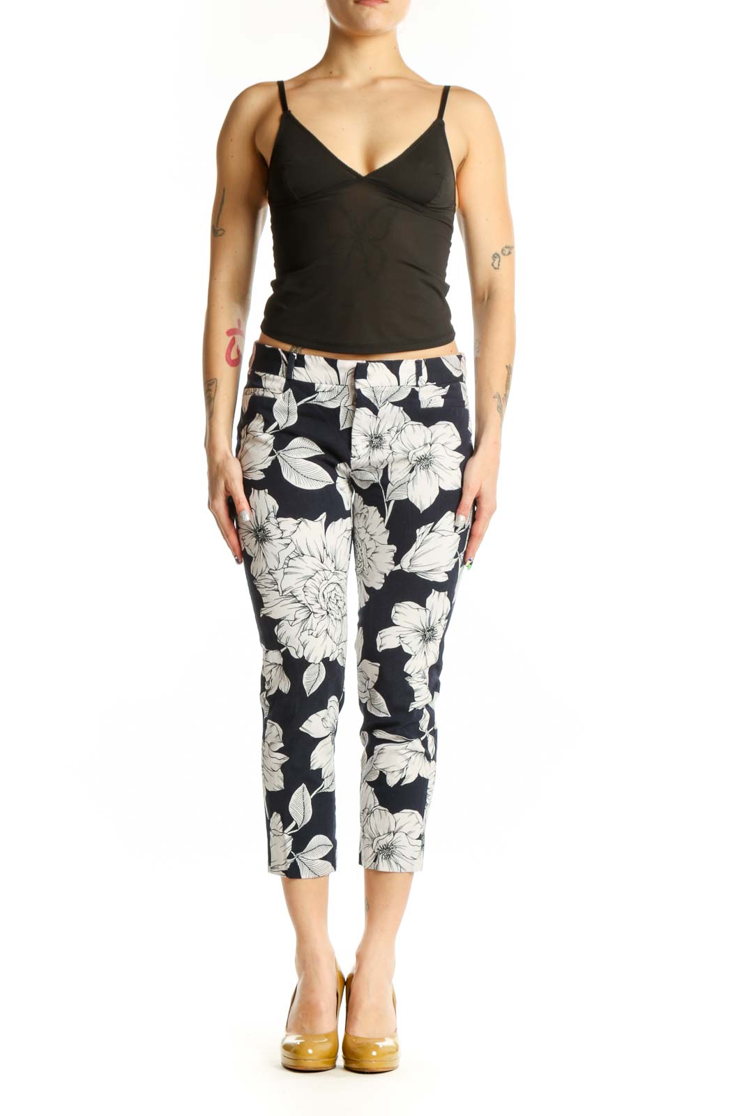 Navy floral cropped capri pants with white botanical print, front view on model