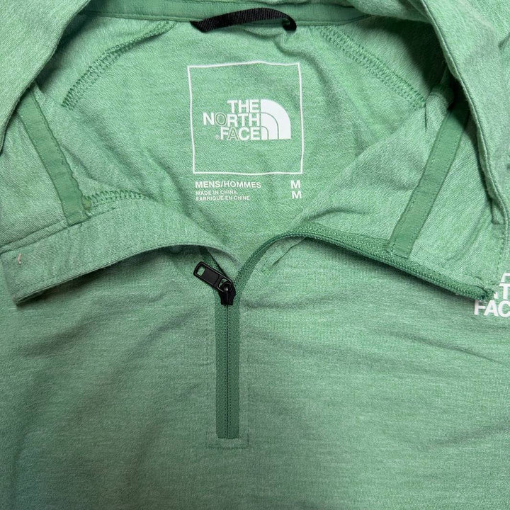 Sage green The North Face quarter-zip pullover back view, showing relaxed fit and long sleeves