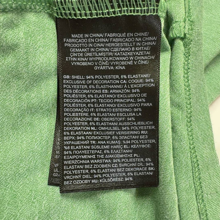 Sage green The North Face quarter-zip pullover back view, showing relaxed fit and long sleeves