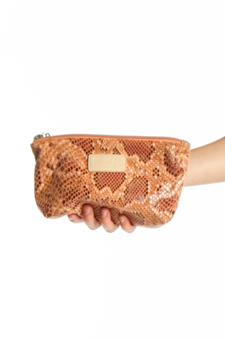 Tan python print small clutch with gold nameplate detail by Sorial New York