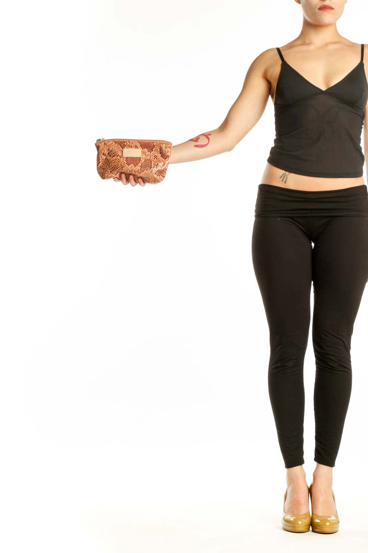 Tan python print small clutch with gold nameplate detail by Sorial New York