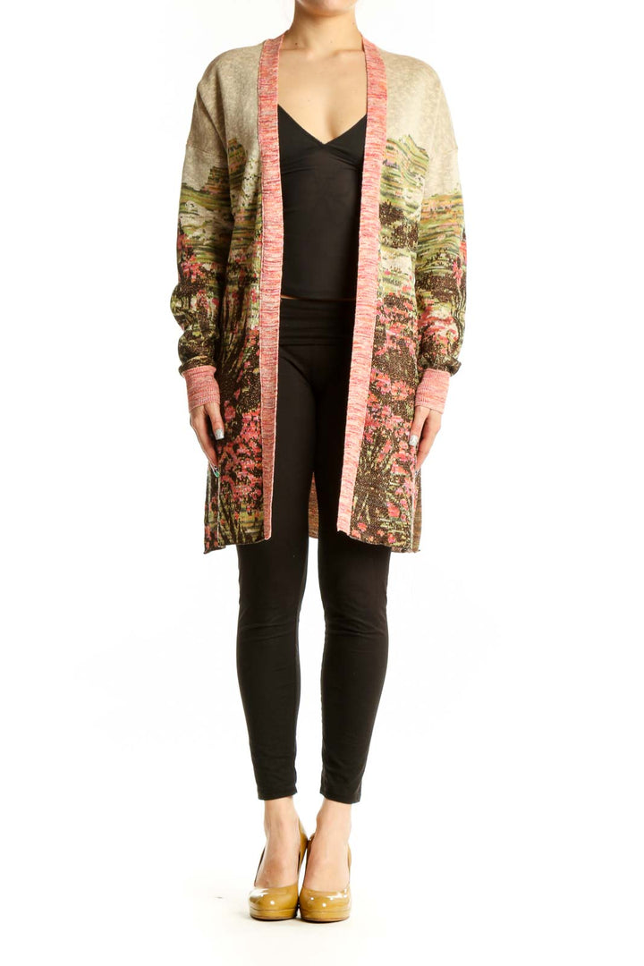 Multicolor floral cardigan with metallic accents and pink ribbed trim worn over black top, front view