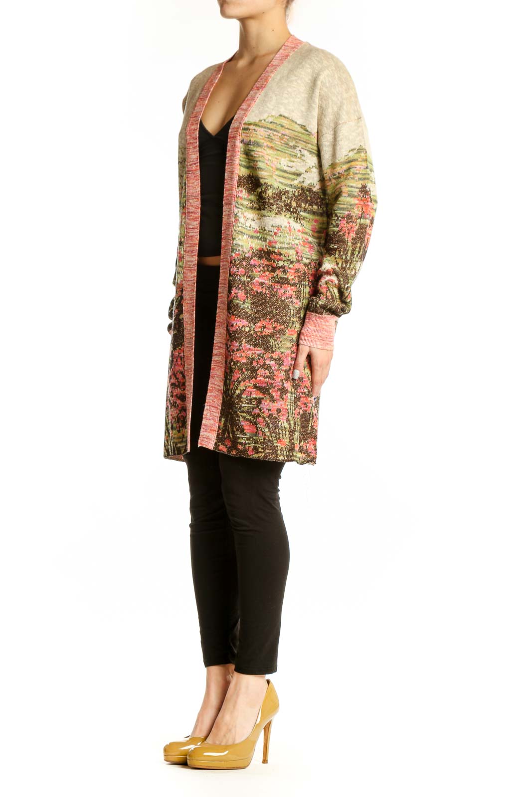 Multicolor floral cardigan with metallic accents and pink ribbed trim worn over black top, front view