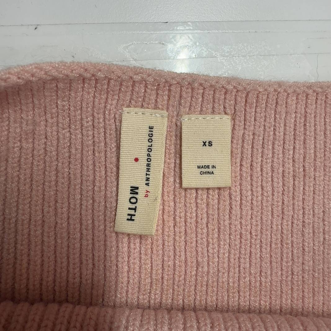 Tag view of blush pink ribbed knit pullover sweater showing relaxed fit and cropped silhouette