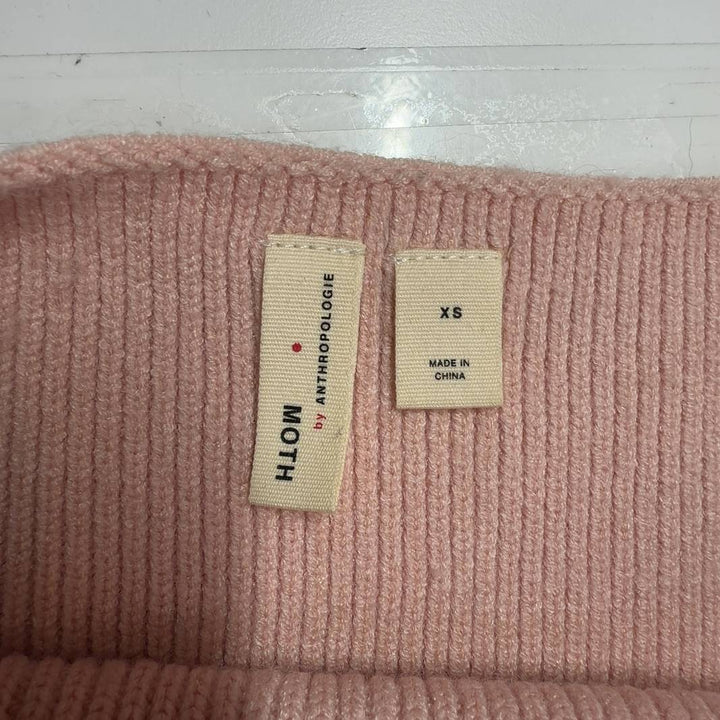 Tag view of blush pink ribbed knit pullover sweater showing relaxed fit and cropped silhouette