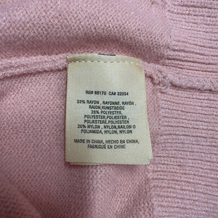 Tag view of blush pink ribbed knit pullover sweater showing relaxed fit and cropped silhouette