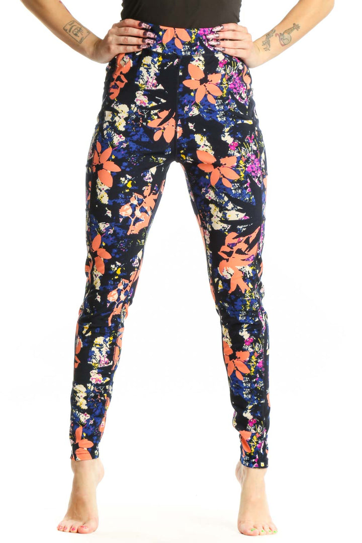 Navy floral print Pop Fit activewear leggings front view, featuring vibrant orange, pink, and yellow botanical design
