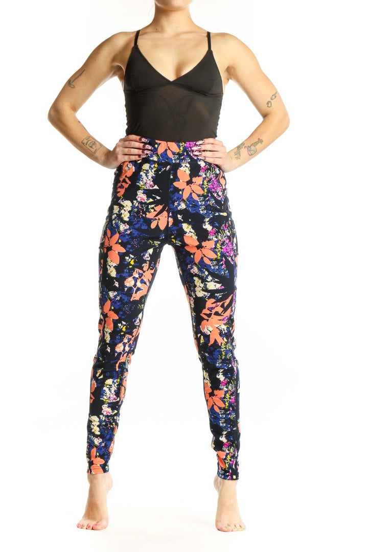 Navy floral print Pop Fit activewear leggings front view, featuring vibrant orange, pink, and yellow botanical design