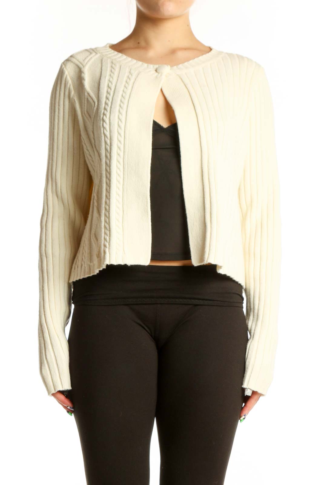 Cream ribbed knit cropped cardigan with cable knit detailing and open front, worn over black top
