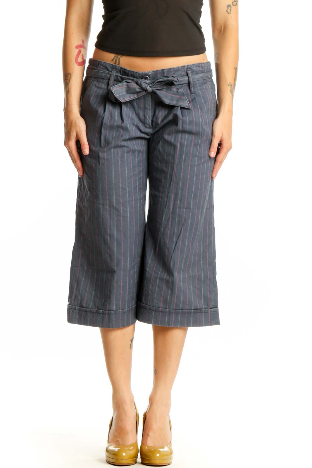 Gray pinstriped cropped shorts with tie-waist detail, front view on model