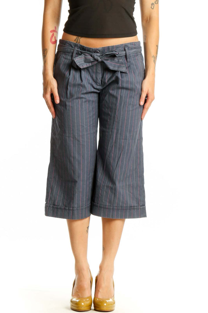 Gray pinstriped cropped shorts with tie-waist detail, front view on model