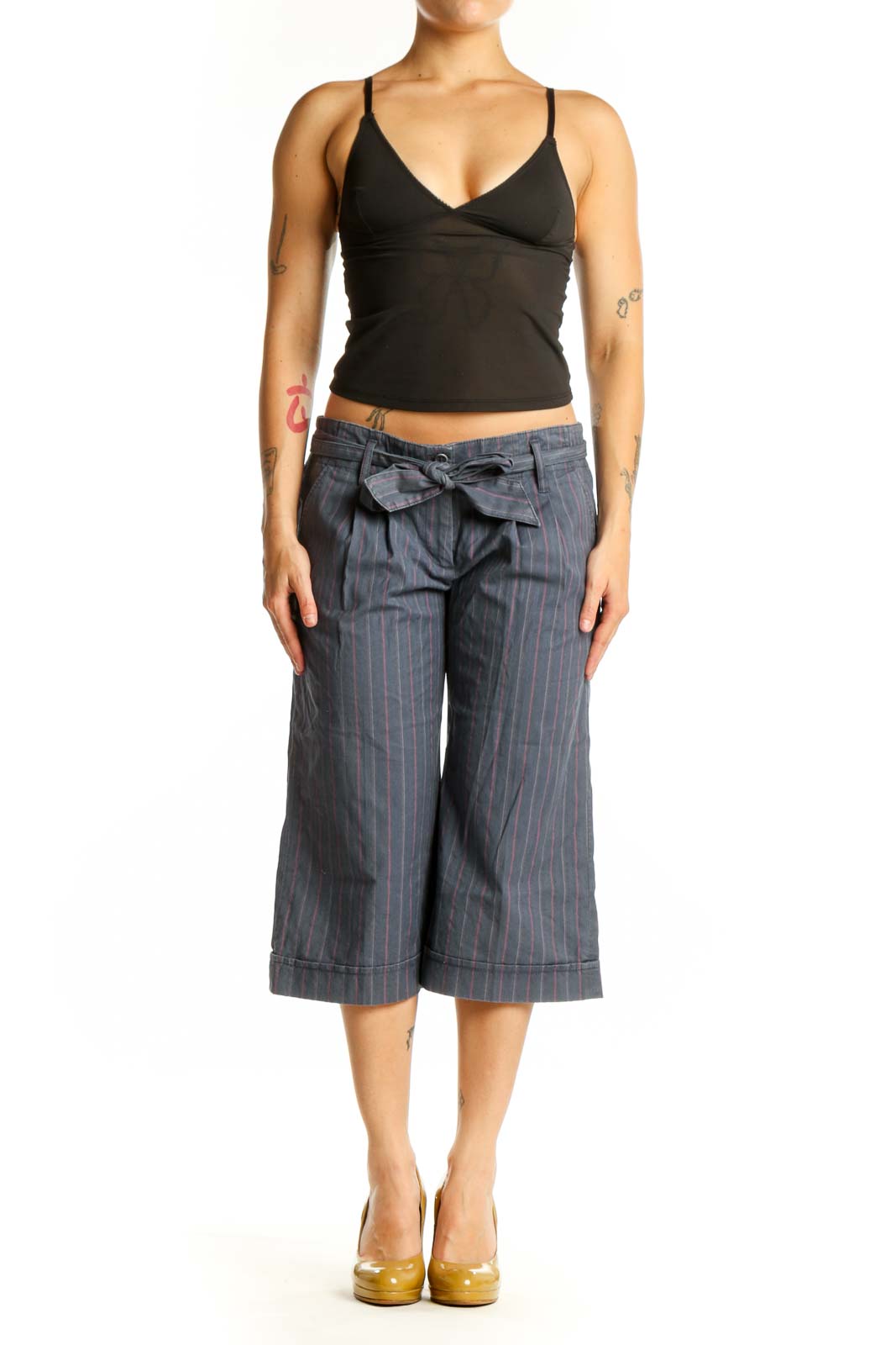 Gray pinstriped cropped shorts with tie-waist detail, front view on model
