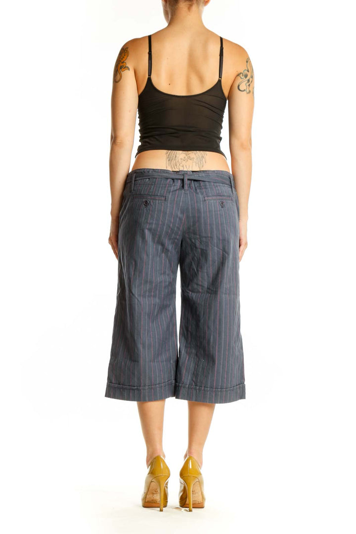 Gray pinstriped cropped shorts with tie-waist detail, back view on model