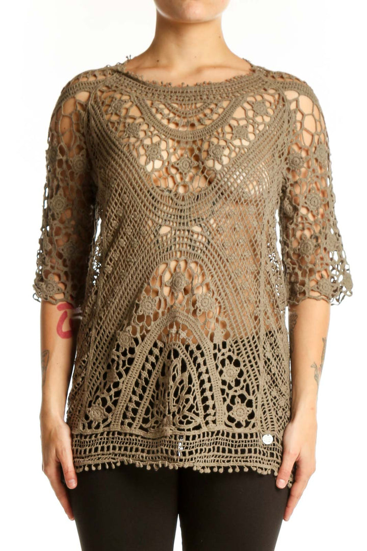 Beige crochet lace knit top with intricate open-weave pattern and three-quarter sleeves, front view