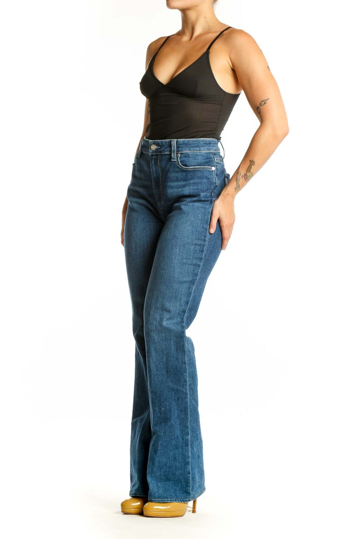 Front view of blue high-waisted flare denim jeans by Paige, size L, showing classic five-pocket design and medium indigo wash