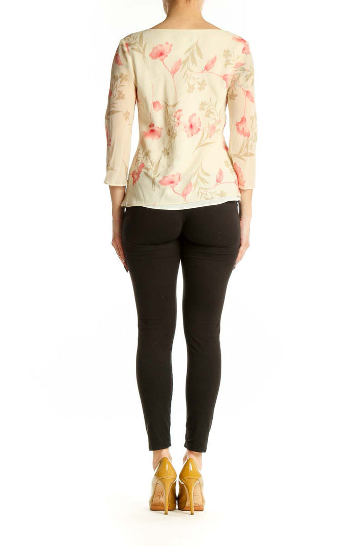 Back view of cream floral Banana Republic top showing botanical print pattern and three-quarter sleeve detail