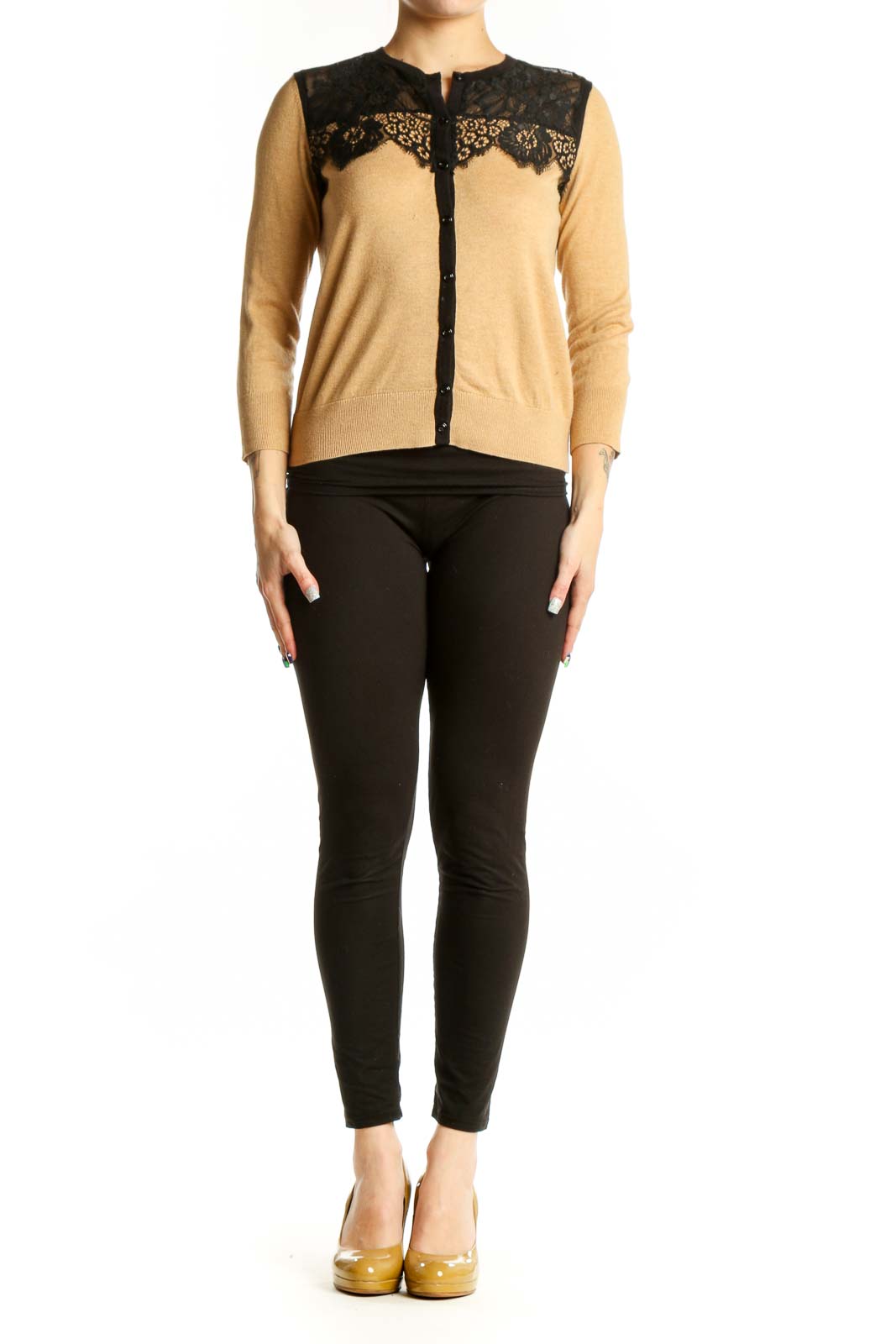 Beige cardigan with black lace trim neckline, three-quarter sleeves, and button-front closure