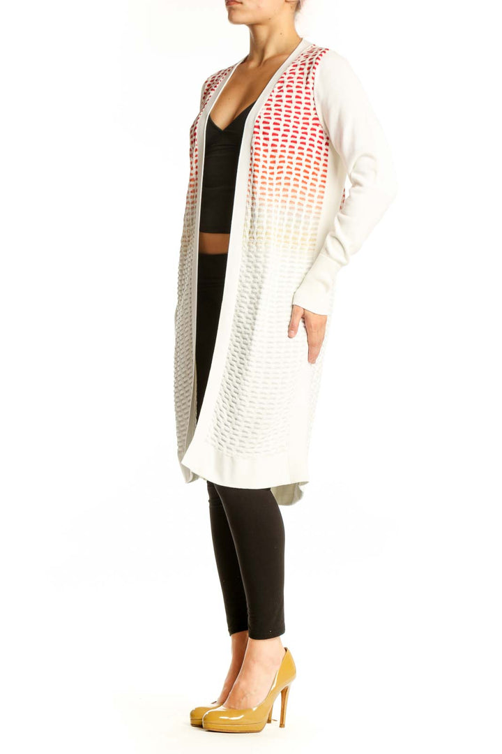 MAGASCHONI cream and red ombre knit cardigan worn open over black crop top and leggings, front view
