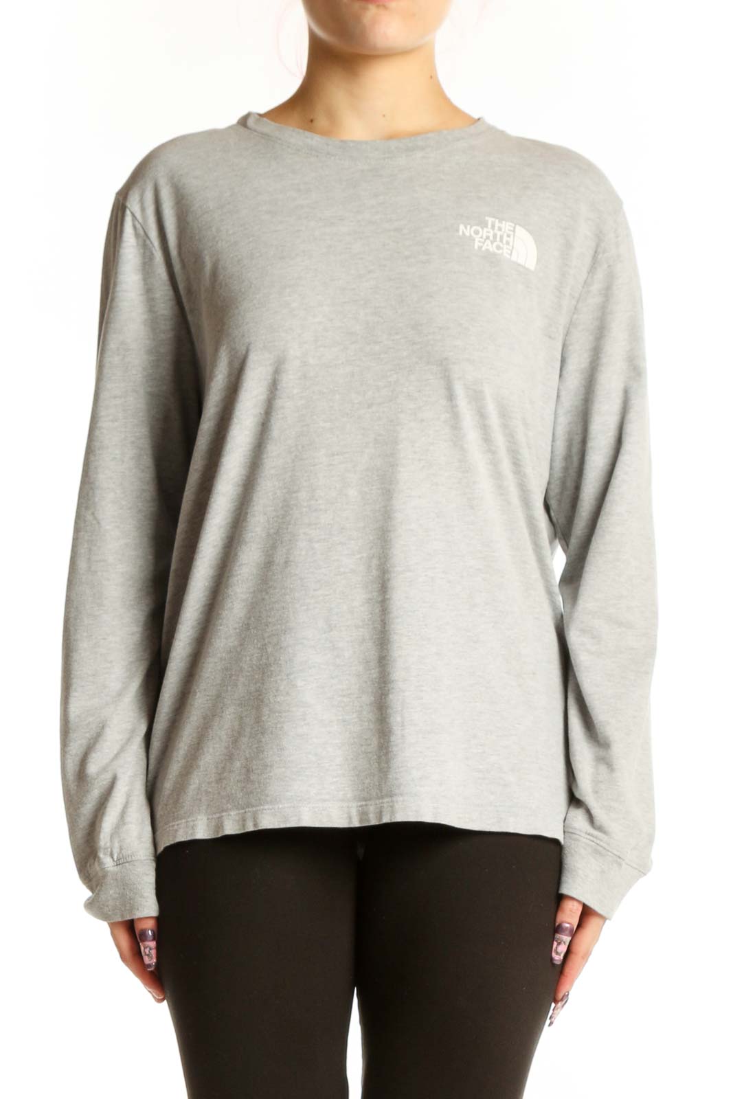 Gray long sleeve The North Face tee with white logo on chest, worn with black leggings