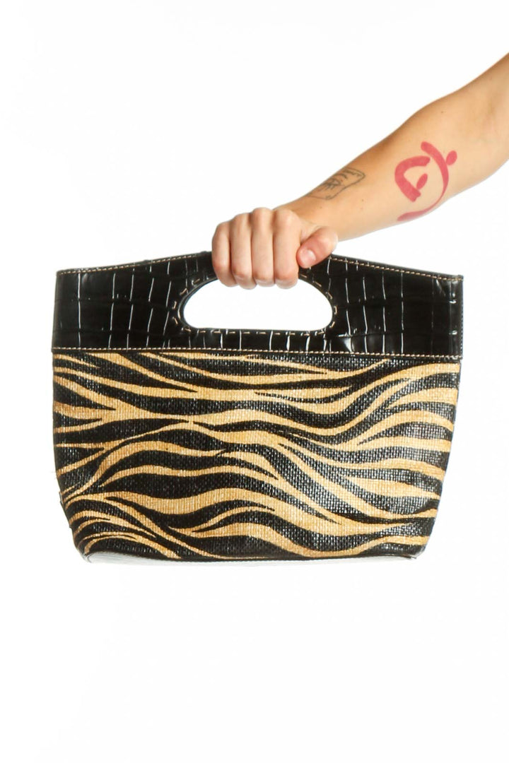 Black and gold zebra print Franco Sarto clutch with croc-embossed black leather handle, front view