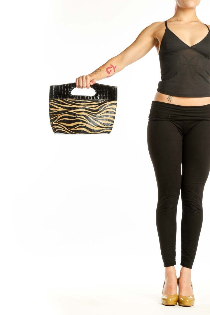 Black and gold zebra print Franco Sarto clutch with croc-embossed black leather handle, front view