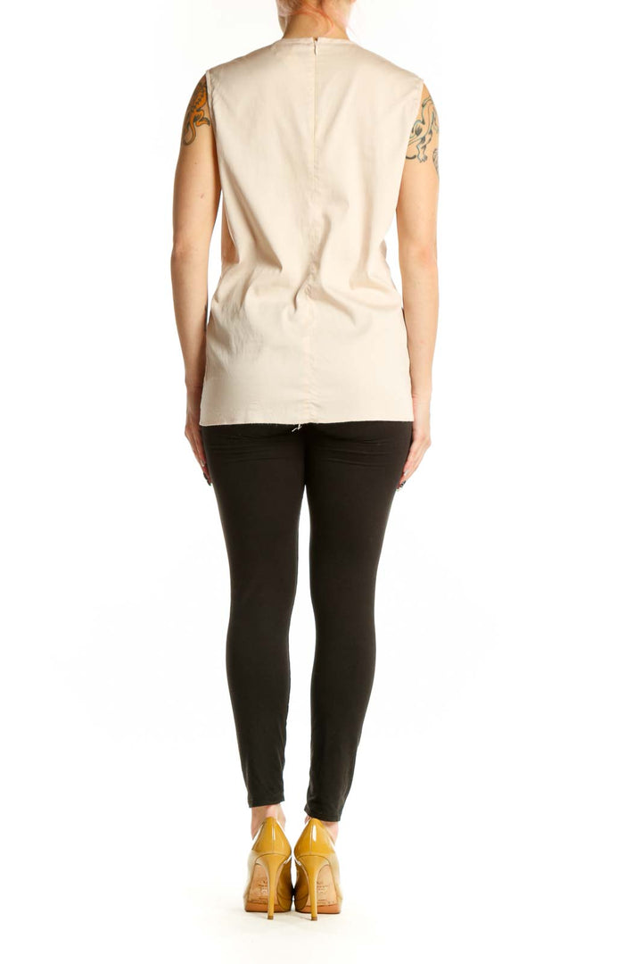 Argenti cream sleeveless ruched top back view, displaying the elegant ruched waist design and sleeveless cut