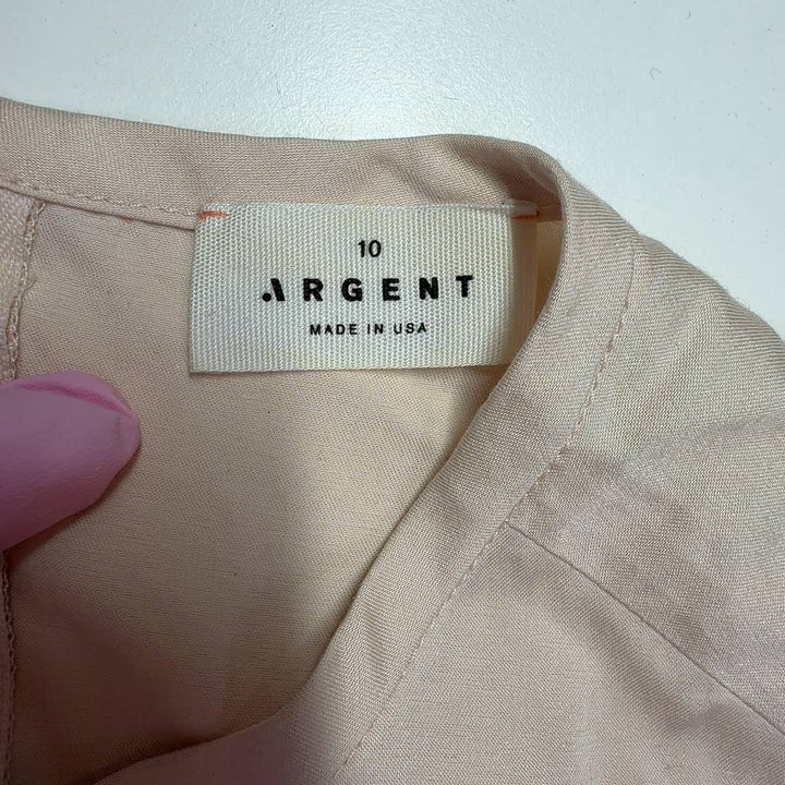Argenti cream sleeveless ruched top back view, displaying the elegant ruched waist design and sleeveless cut