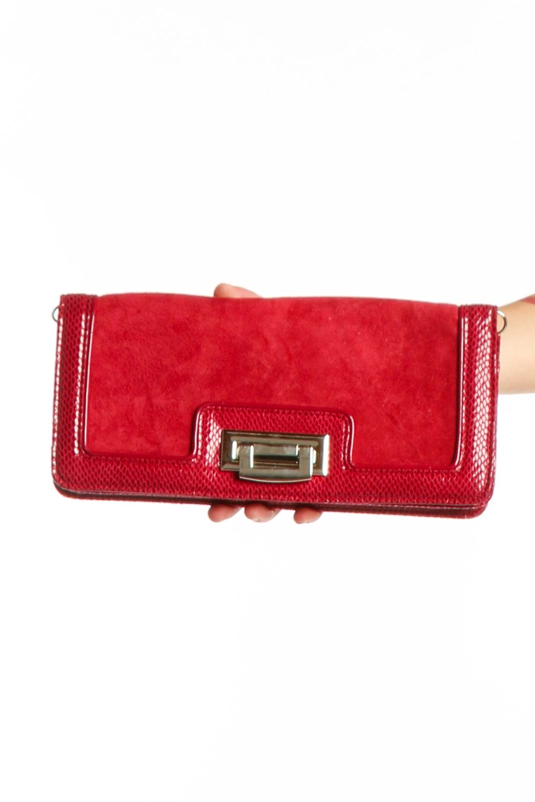 Red leather clutch with textured suede sides and gold-tone flip-lock hardware by White House Black Market