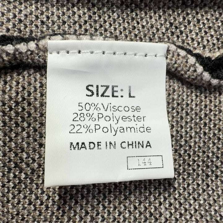 Tag view of black striped sleeveless tank top showing vertical stripe pattern and fitted back design