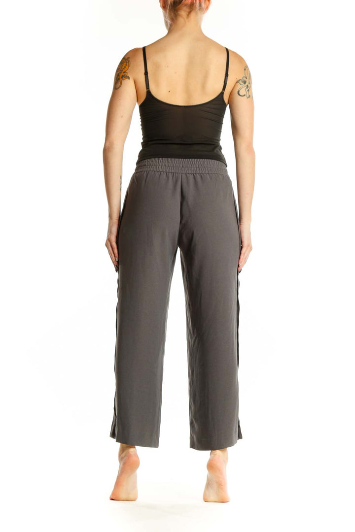 Gray drawstring cropped pants back view showing relaxed silhouette and ankle length