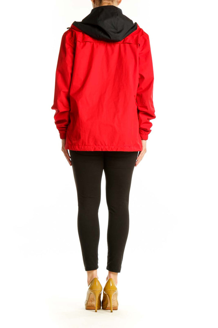 Red Asics windbreaker jacket back view showing full-length design and black hood
