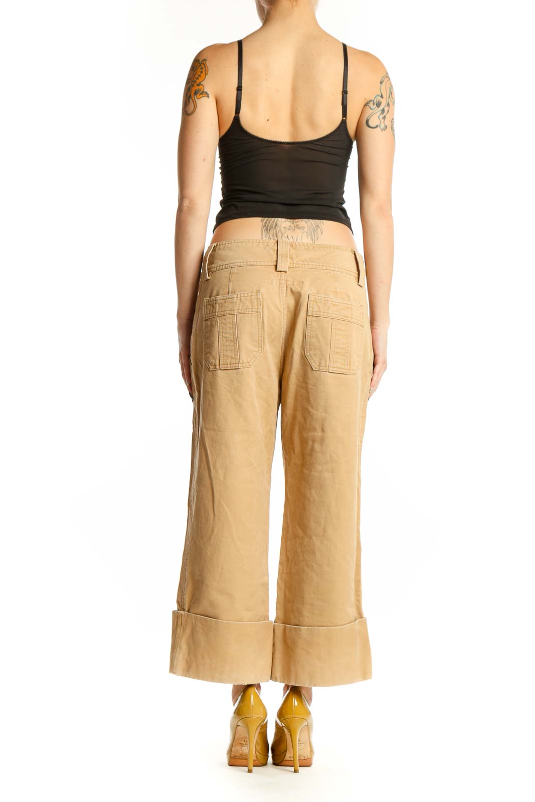 Beige cargo cropped cotton pants with rolled cuffs, back view