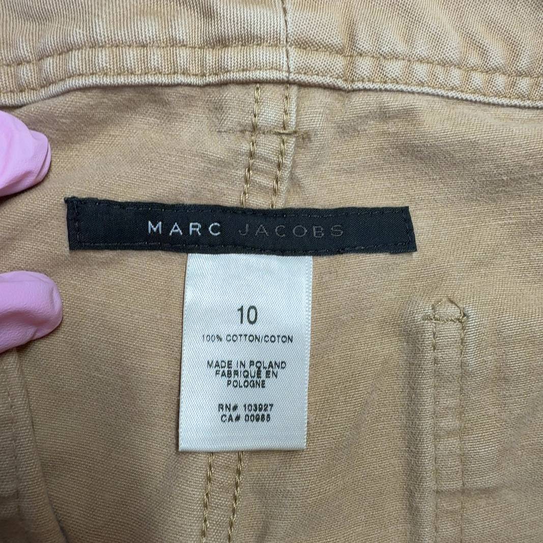 Beige cargo cropped cotton pants with rolled cuffs, back view