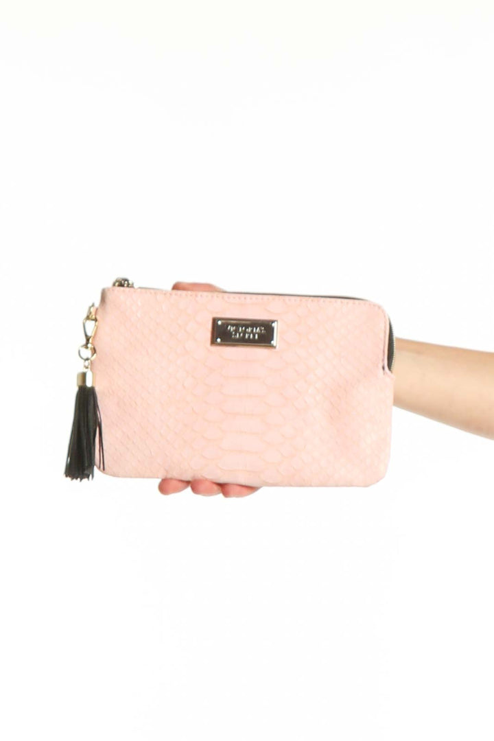 Pink quilted clutch with black tassel charm and gold hardware from Victoria's Secret