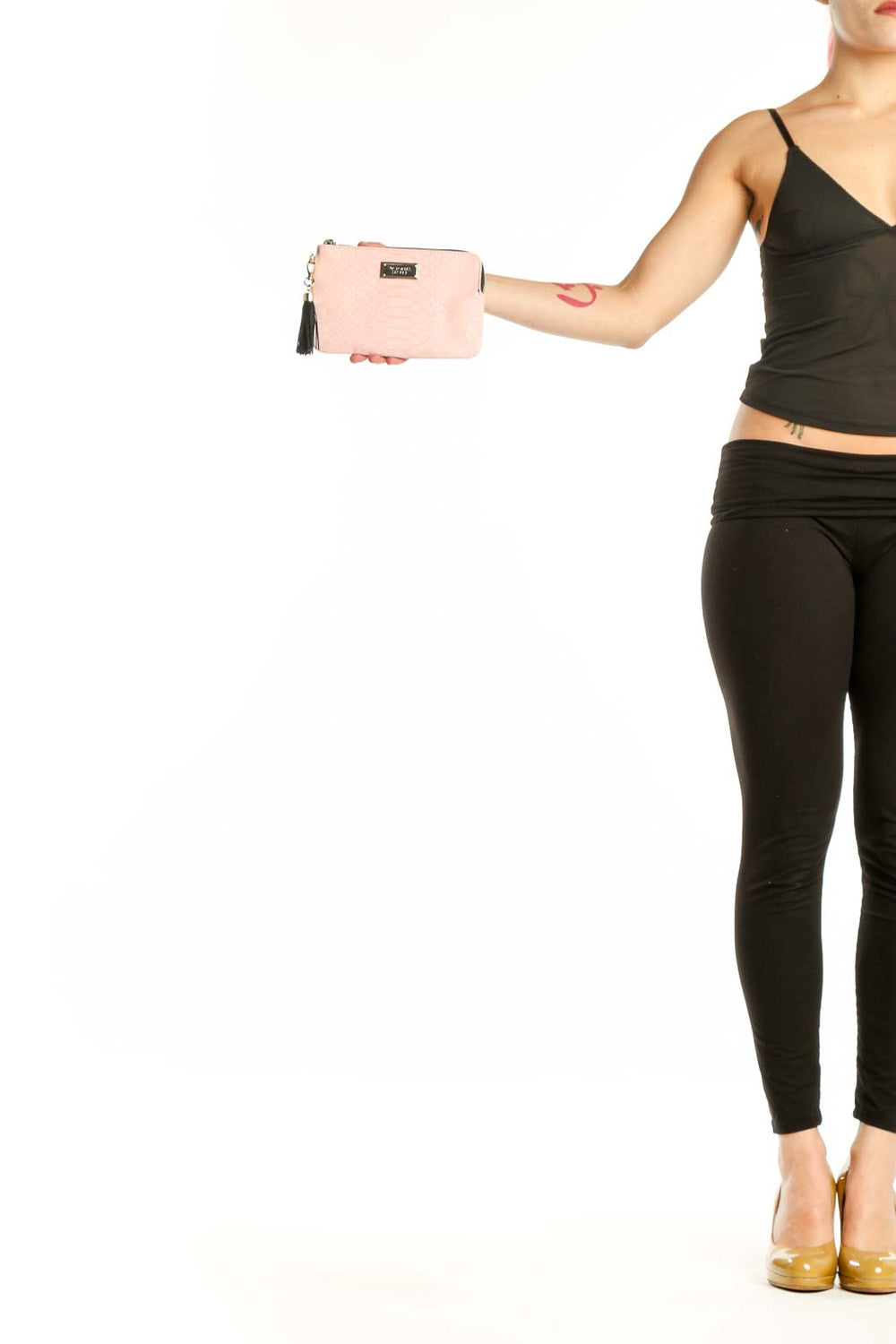 Pink quilted clutch with black tassel charm and gold hardware from Victoria's Secret