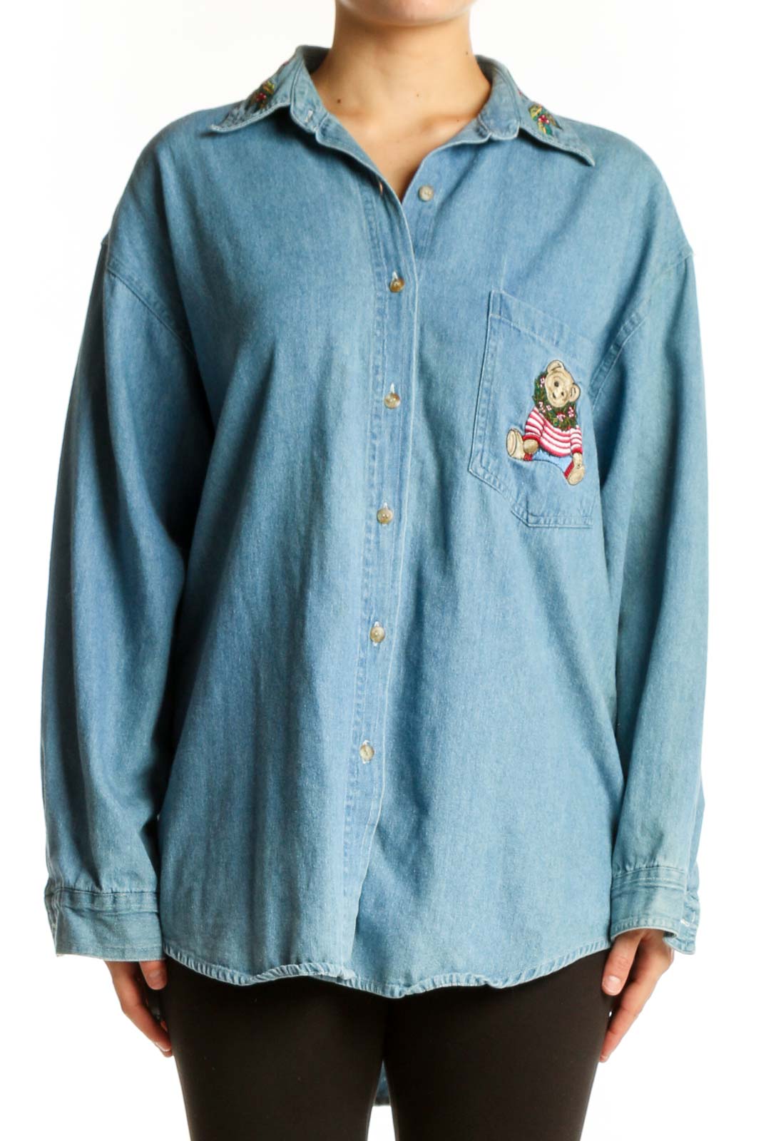Light blue denim button-up shirt with teddy bear embroidery on chest pocket, front view