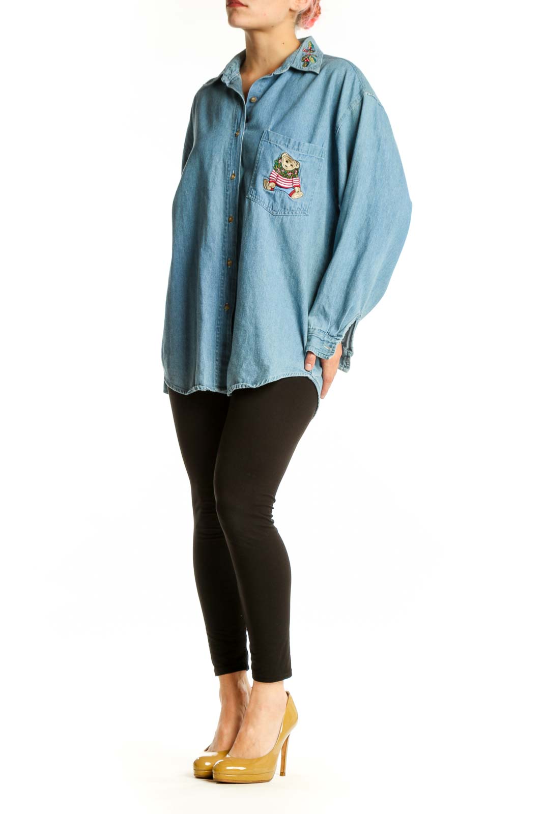 Light blue denim button-up shirt with teddy bear embroidery on chest pocket, front view