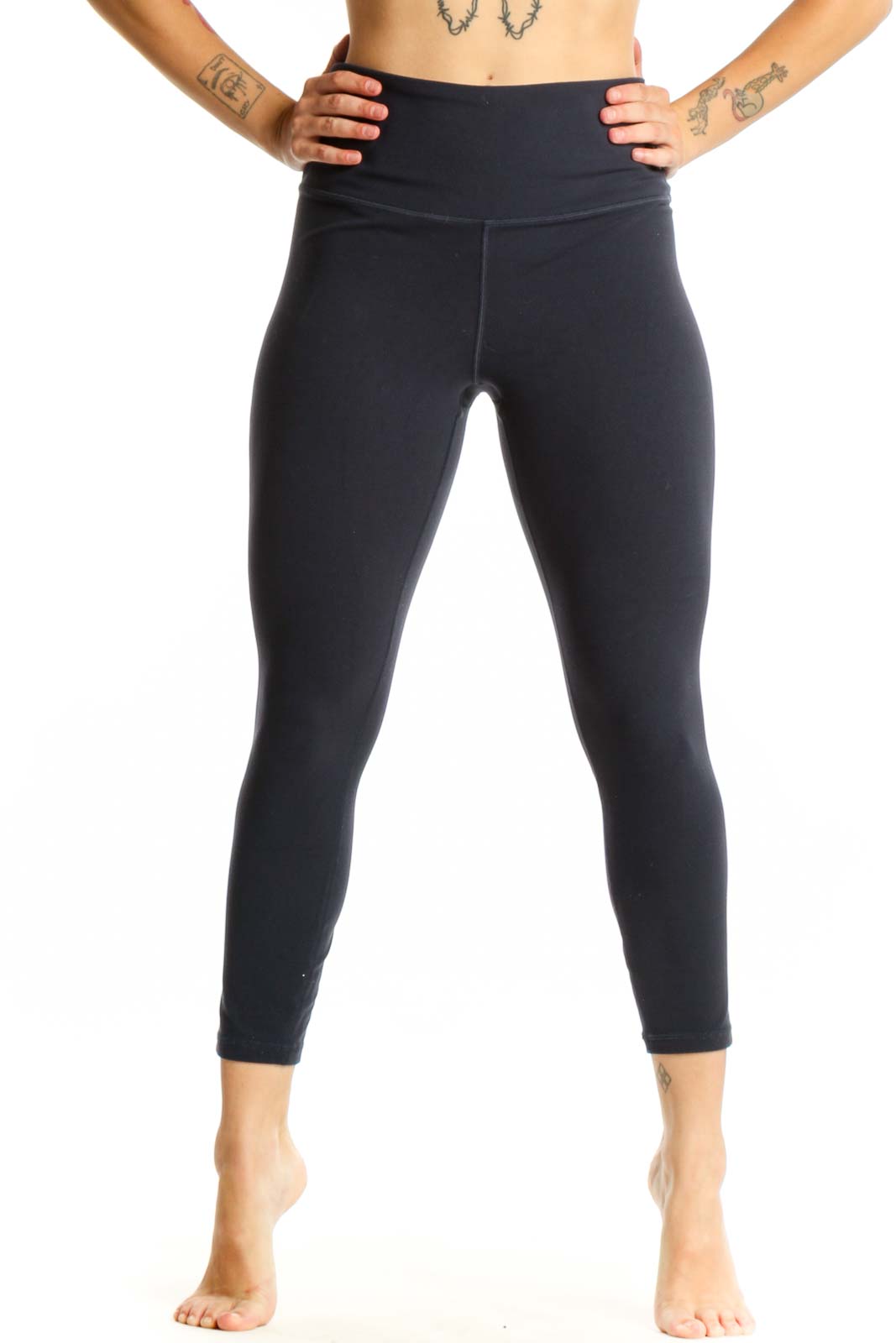 Black high-waist capri leggings front view showing fitted silhouette and wide waistband