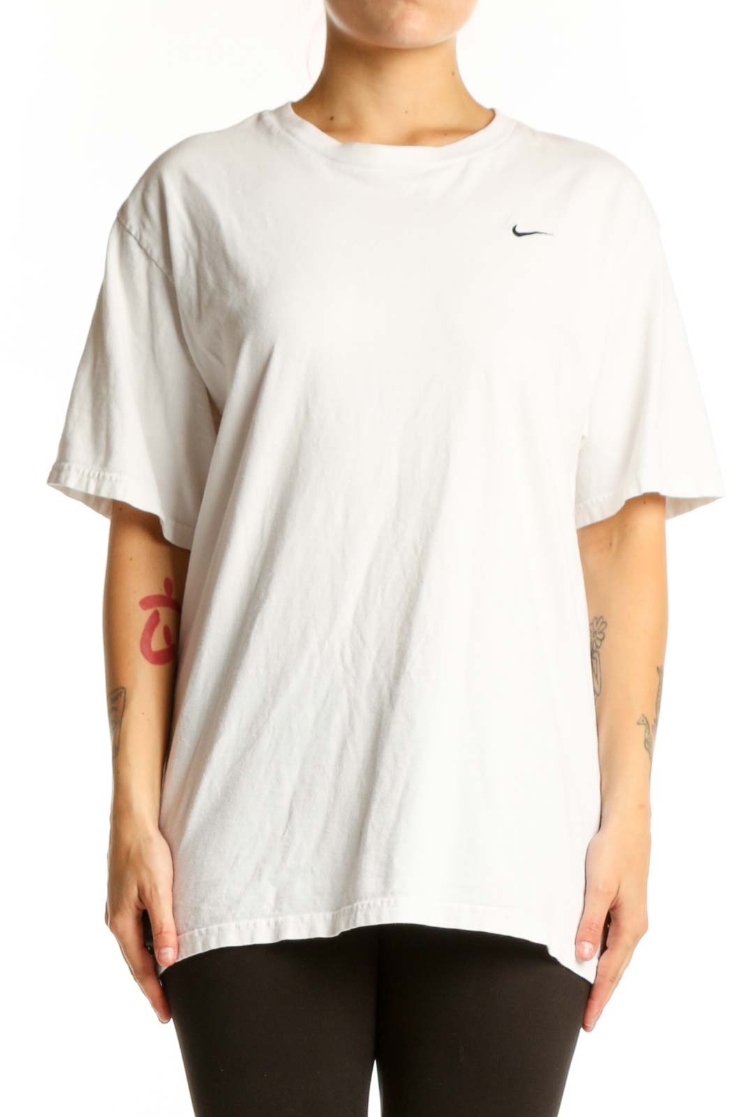 White cotton Nike t-shirt with crew neck and Swoosh logo, front view on model