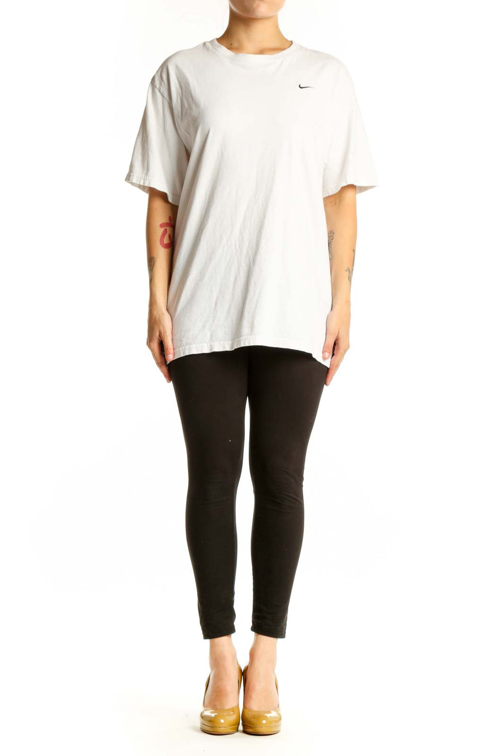 White cotton Nike t-shirt with crew neck and Swoosh logo, front view on model