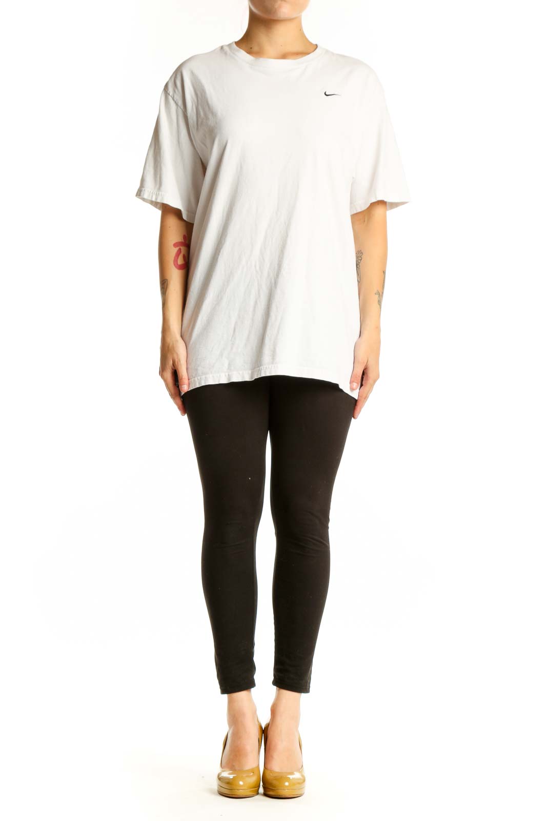 White cotton Nike t-shirt with crew neck and Swoosh logo, front view on model
